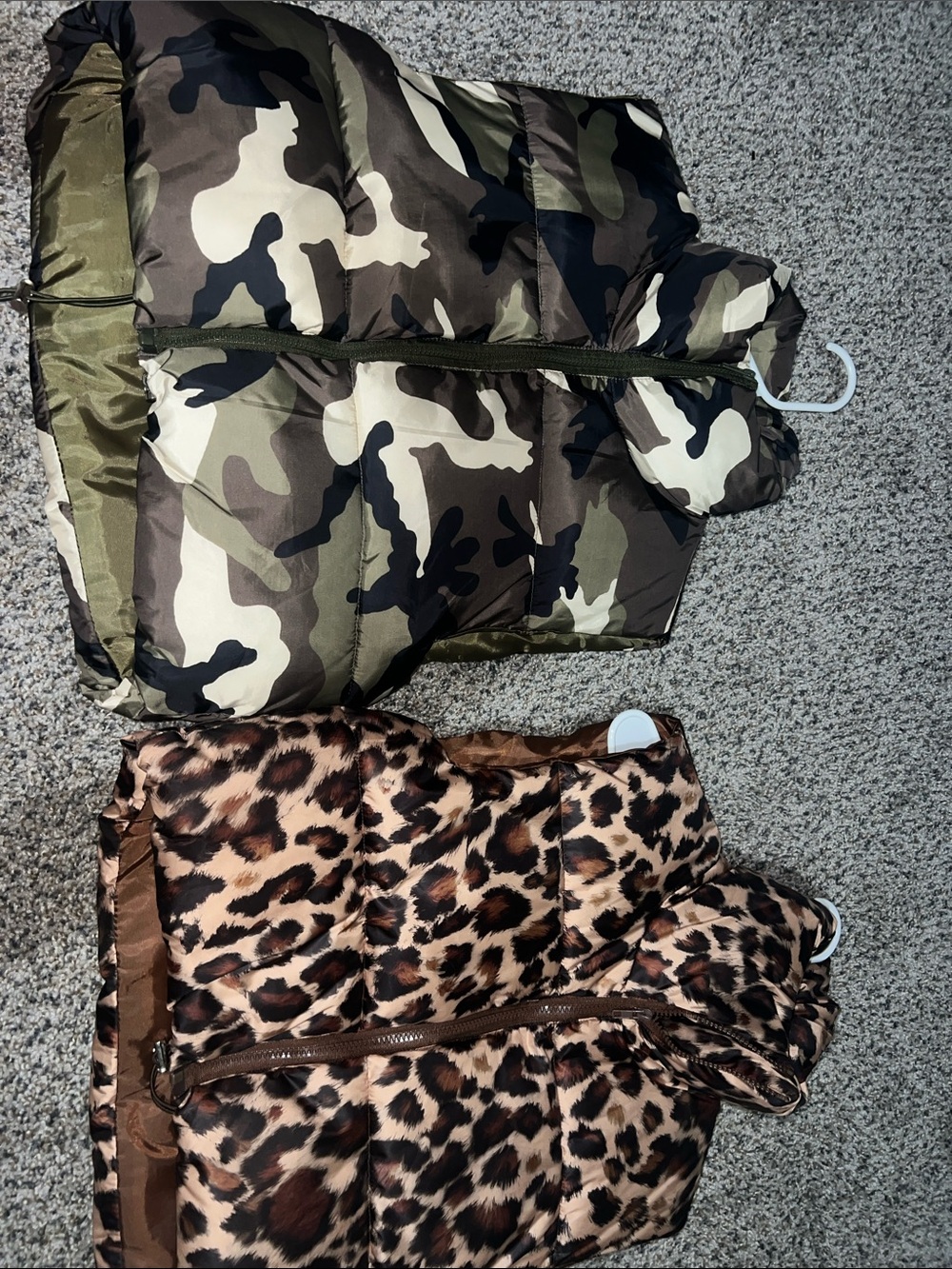 Camo and cheetah print puffer vests.